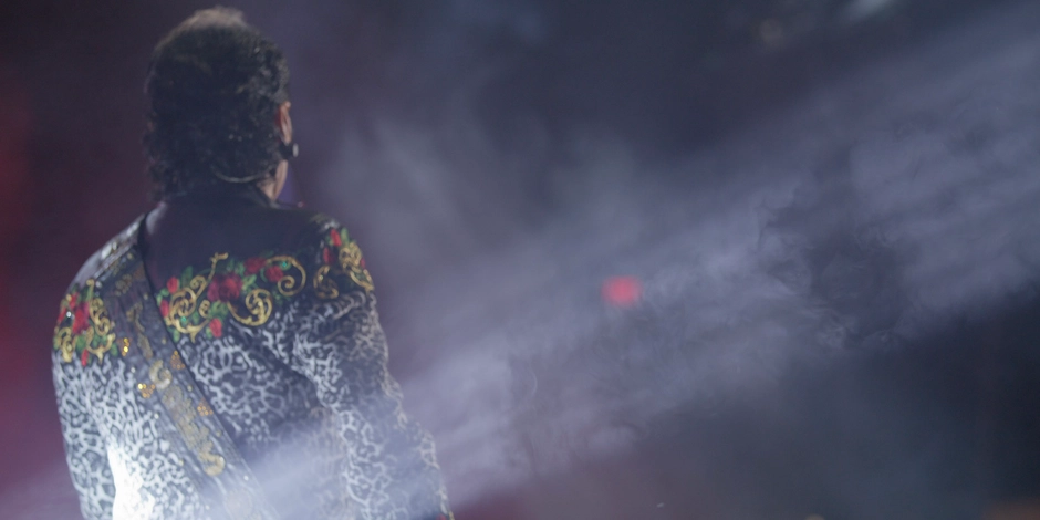 Mariachi performer in concert lights