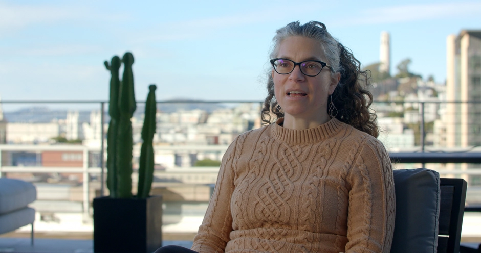 Interviewee sitting on a rooftop