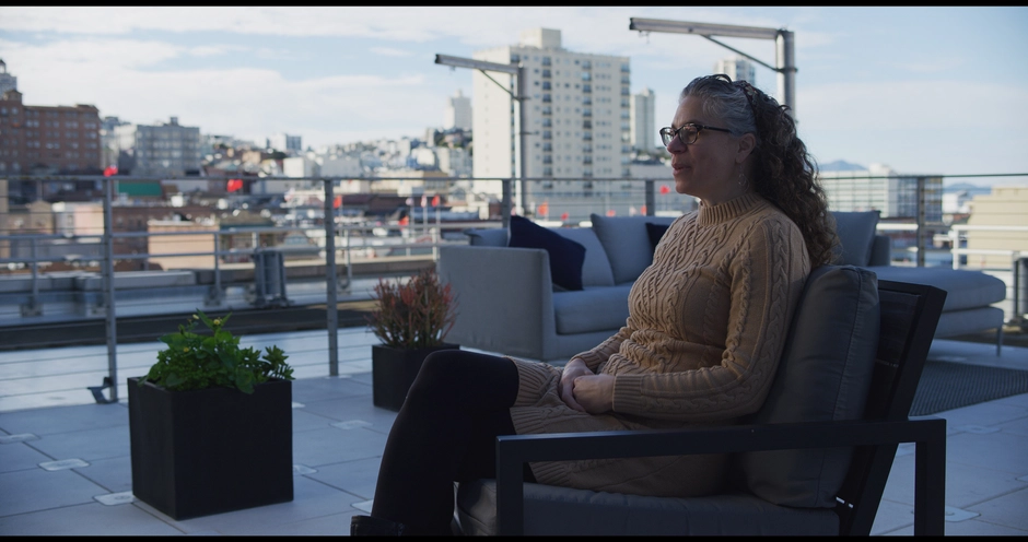 Interviewee sitting on roof top