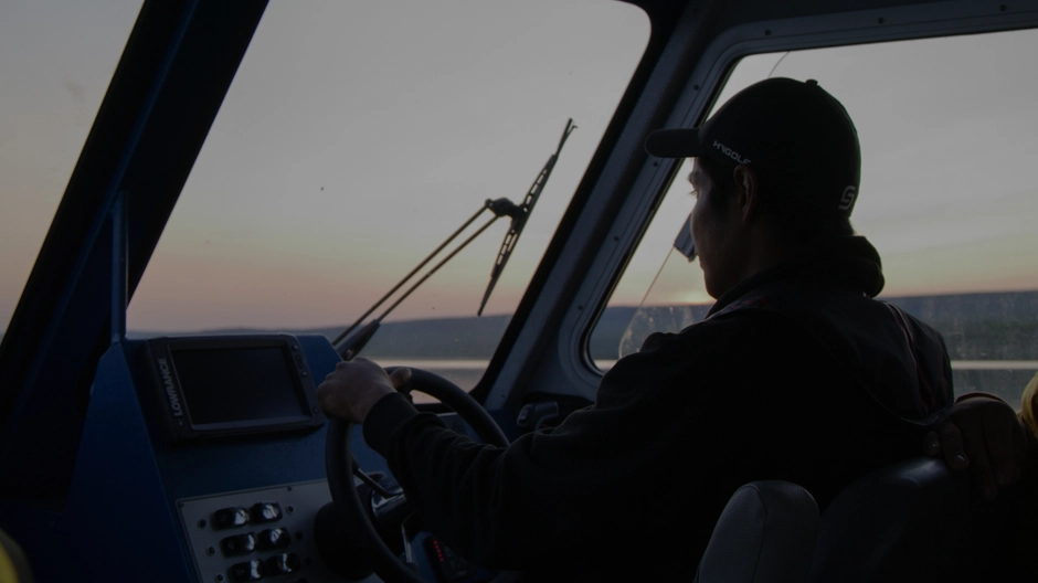 A gaurdian driving the boat