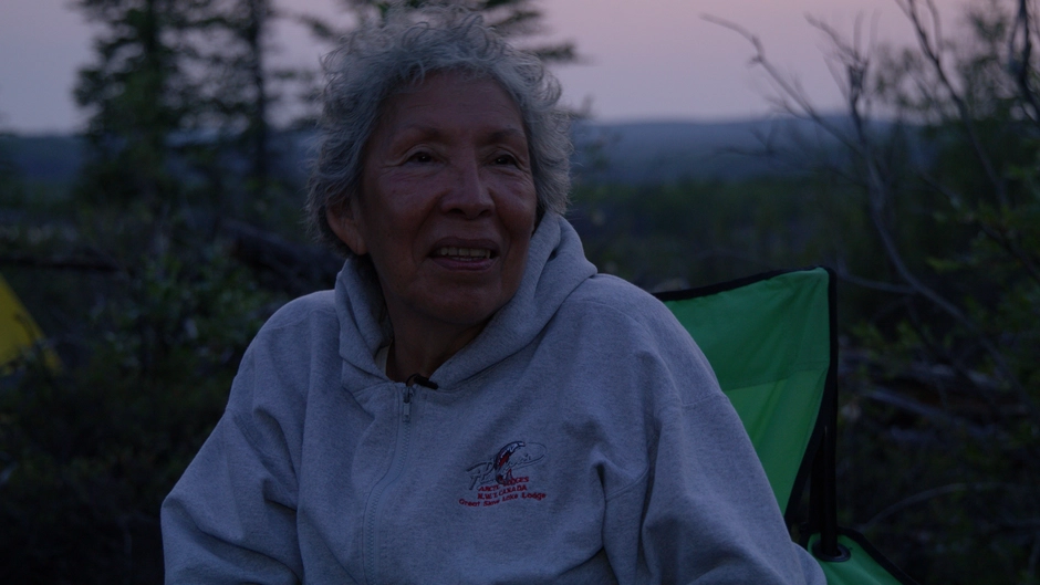 An elder smiles while she talks to the viewers