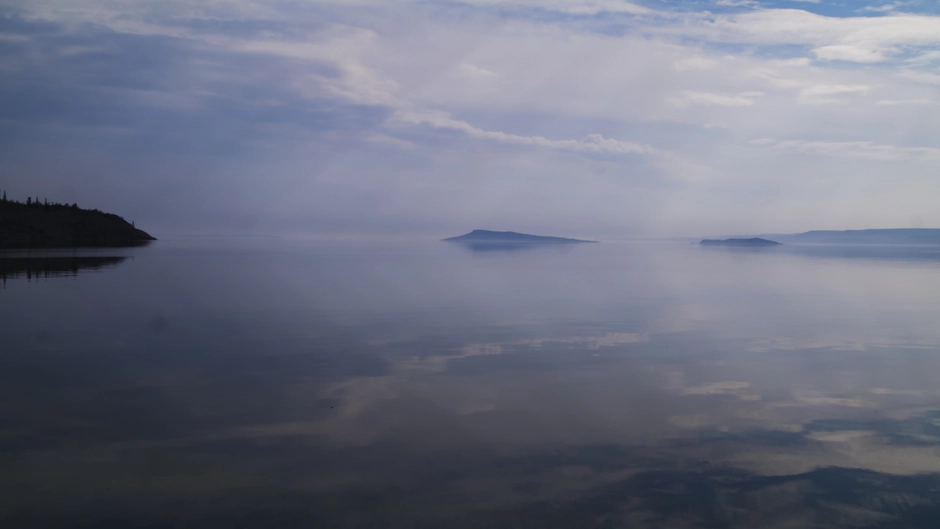 Clouds reflecting in a glassy lake